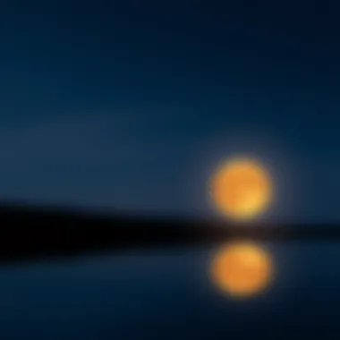 A serene night sky with a full moon reflecting on water